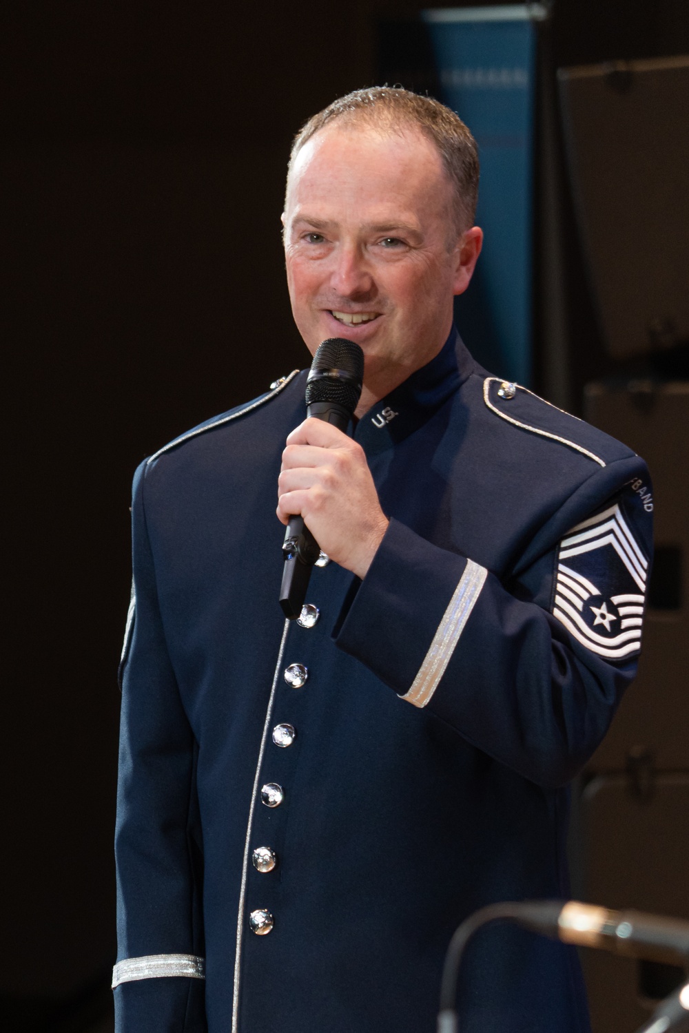 Flight Chief speaks to an audience at Airmen of Note concert