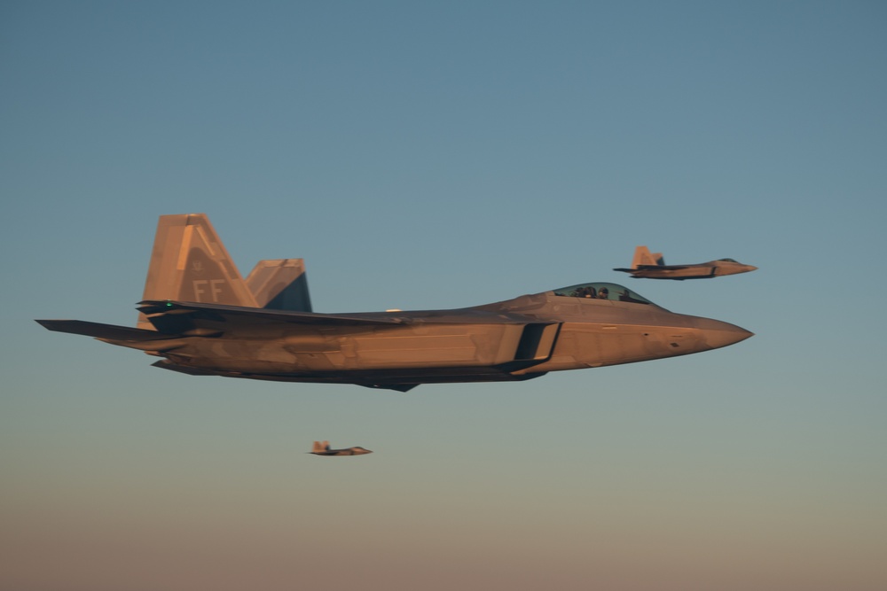 F-22 Raptors perform aerial refueling