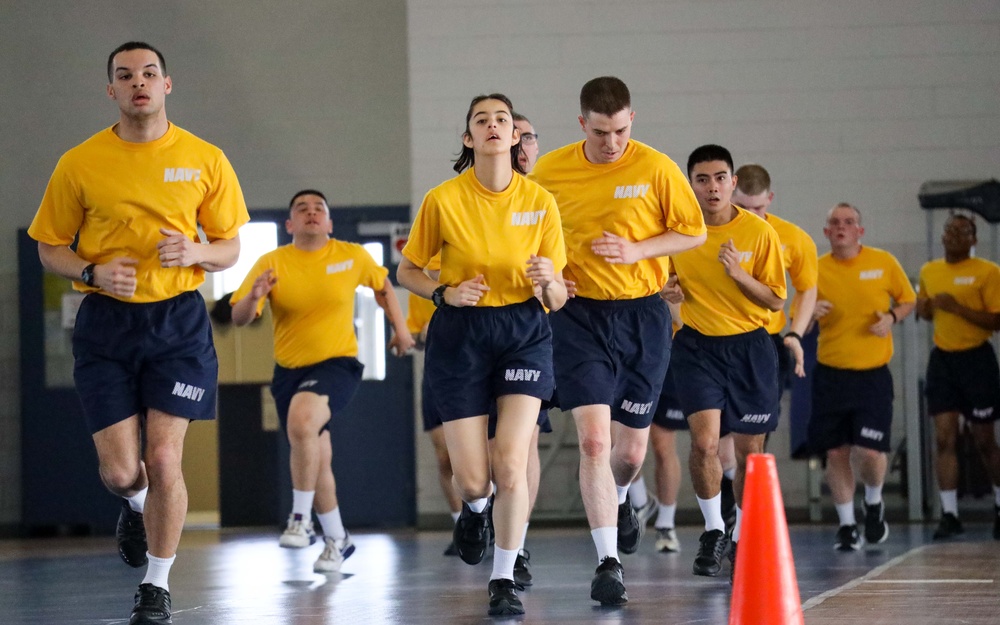 Recruits run in Freedom Hall at Recruit Training Command