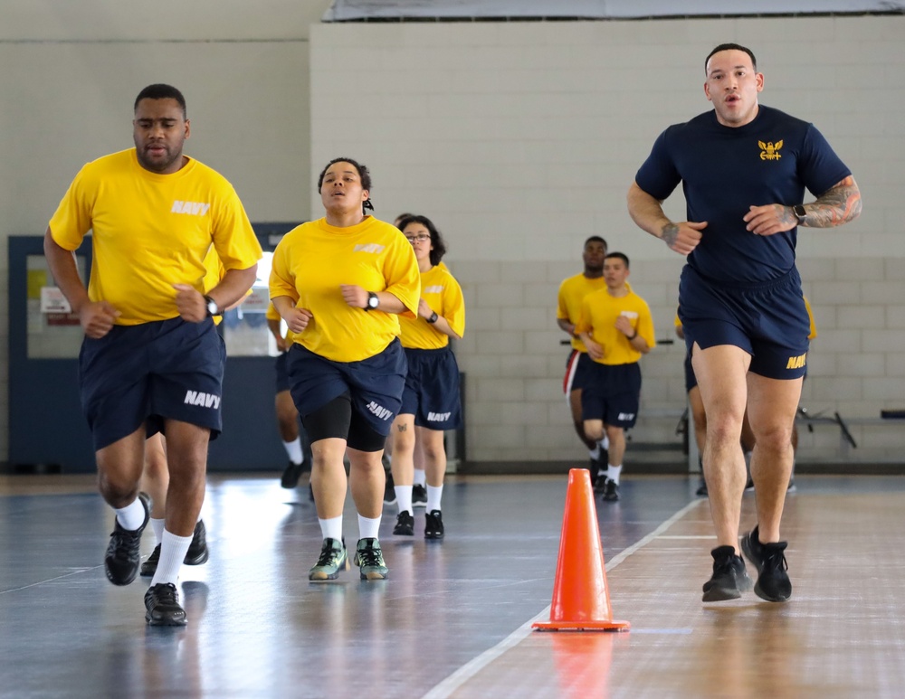 Recruits run in Freedom Hall at Recruit Training Command