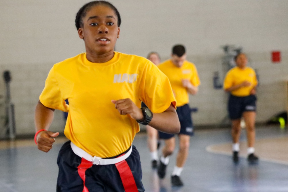 Recruits run in Freedom Hall at Recruit Training Command