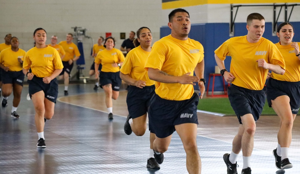 Recruits run in Freedom Hall at Recruit Training Command