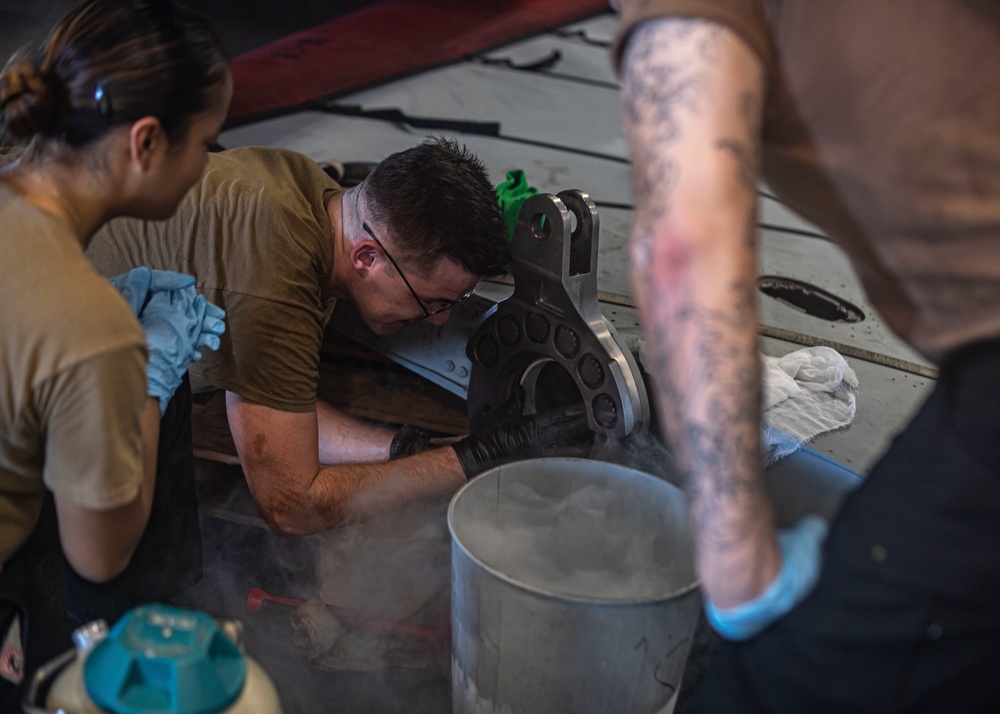 Sailors Perform Maintenance On Aircraft