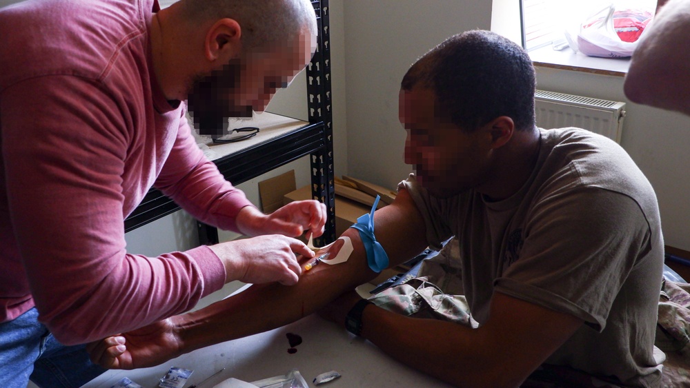 Georgian Special Operations Forces operators perform Tactical Combat Casualty Care alongside U.S. Army Special Forces Soldiers