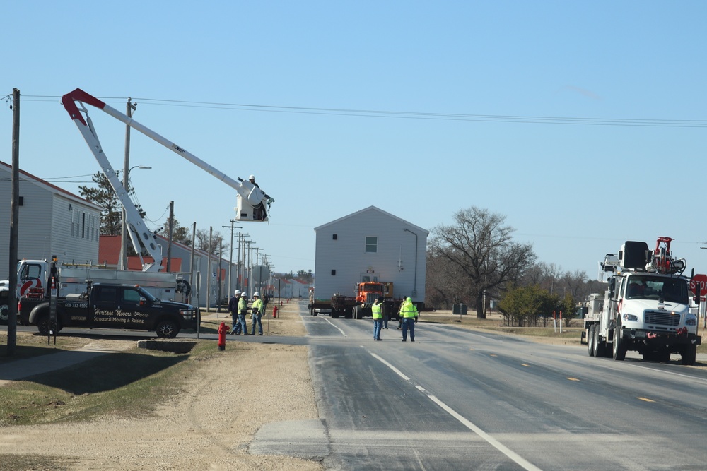 Contractors move fourth World War II-era barracks to new location in April 2023