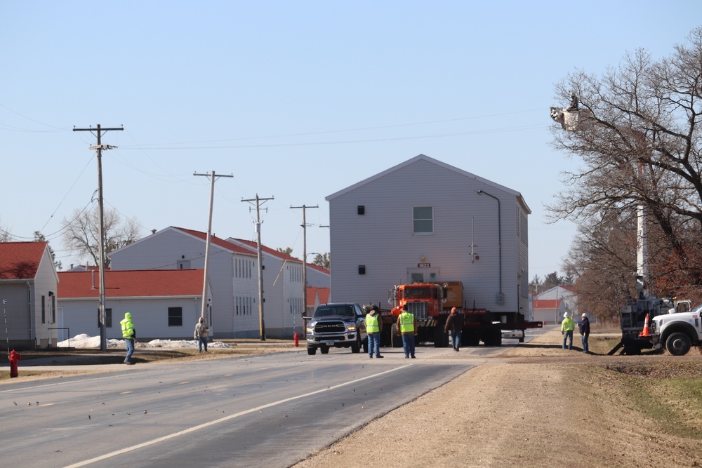 Contractors move fourth World War II-era barracks to new location in April 2023