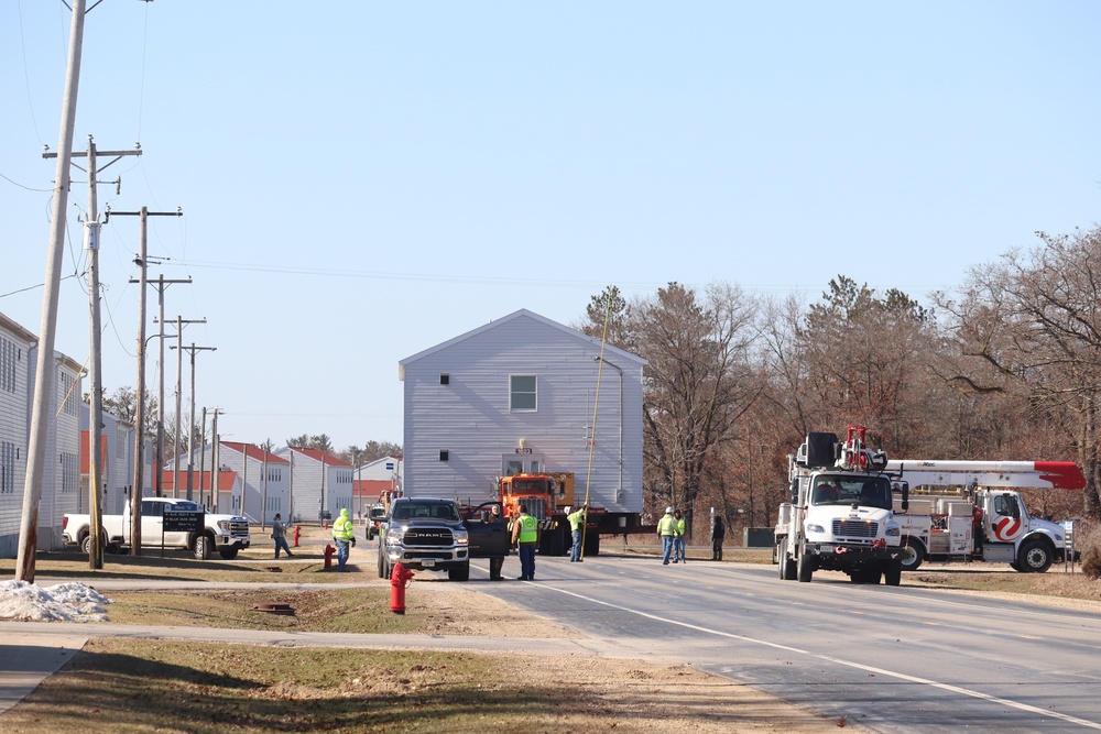 Contractors move fourth World War II-era barracks to new location in April 2023