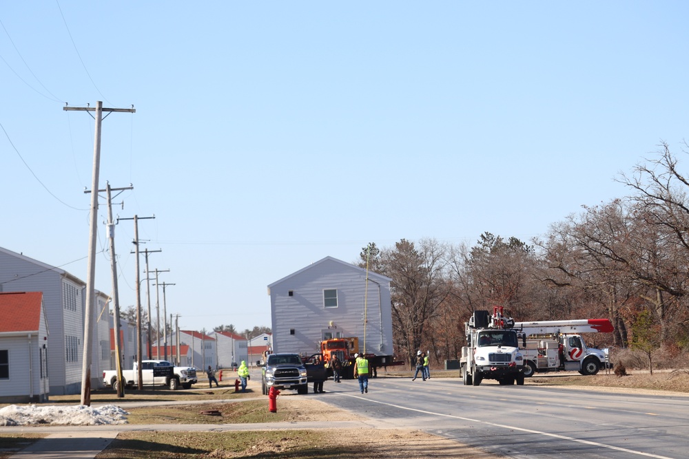 Contractors move fourth World War II-era barracks to new location in April 2023