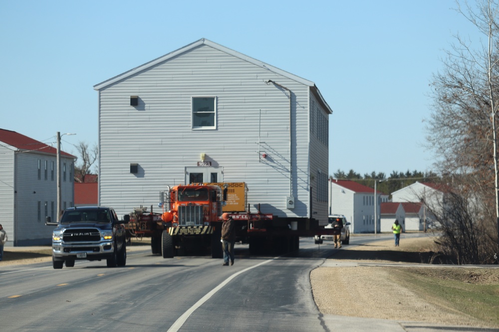 Contractors move fourth World War II-era barracks to new location in April 2023