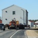 Contractors move fourth World War II-era barracks to new location in April 2023