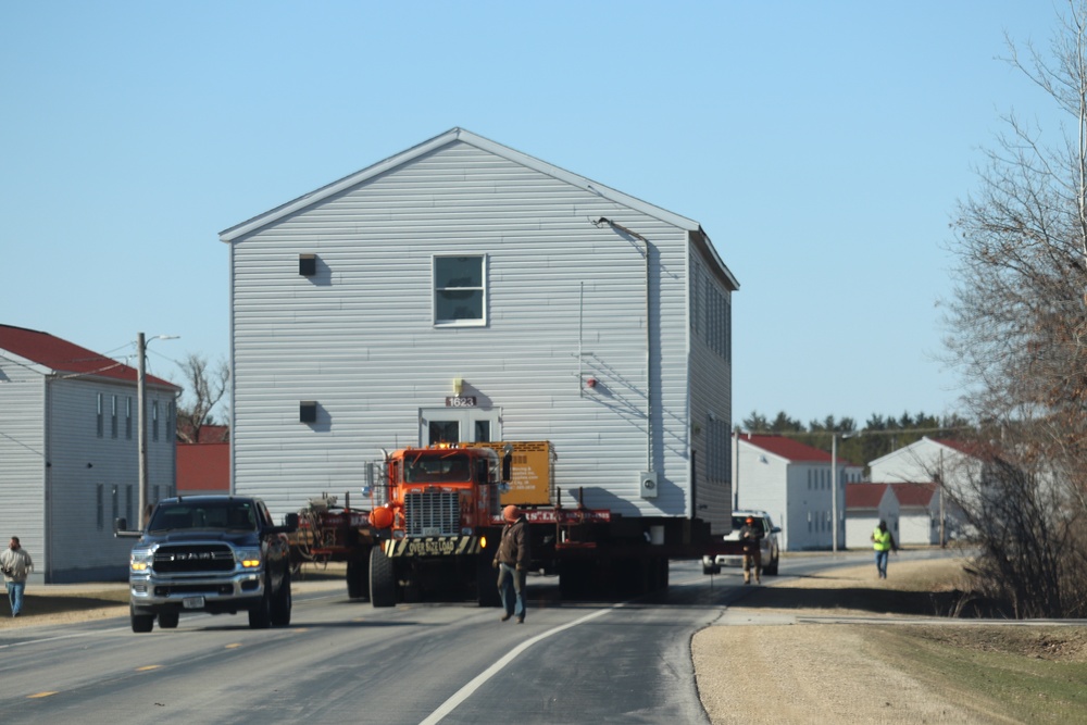 Contractors move fourth World War II-era barracks to new location in April 2023