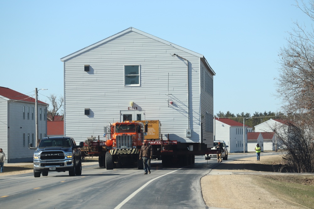 Contractors move fourth World War II-era barracks to new location in April 2023