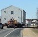 Contractors move fourth World War II-era barracks to new location in April 2023