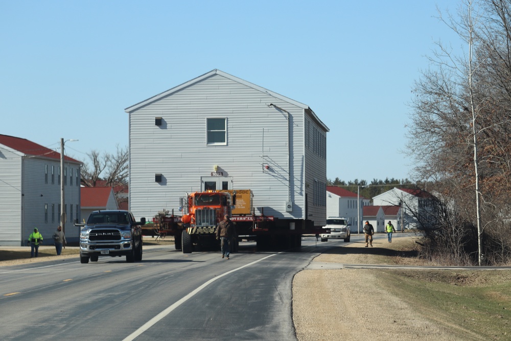 Contractors move fourth World War II-era barracks to new location in April 2023