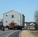 Contractors move fourth World War II-era barracks to new location in April 2023