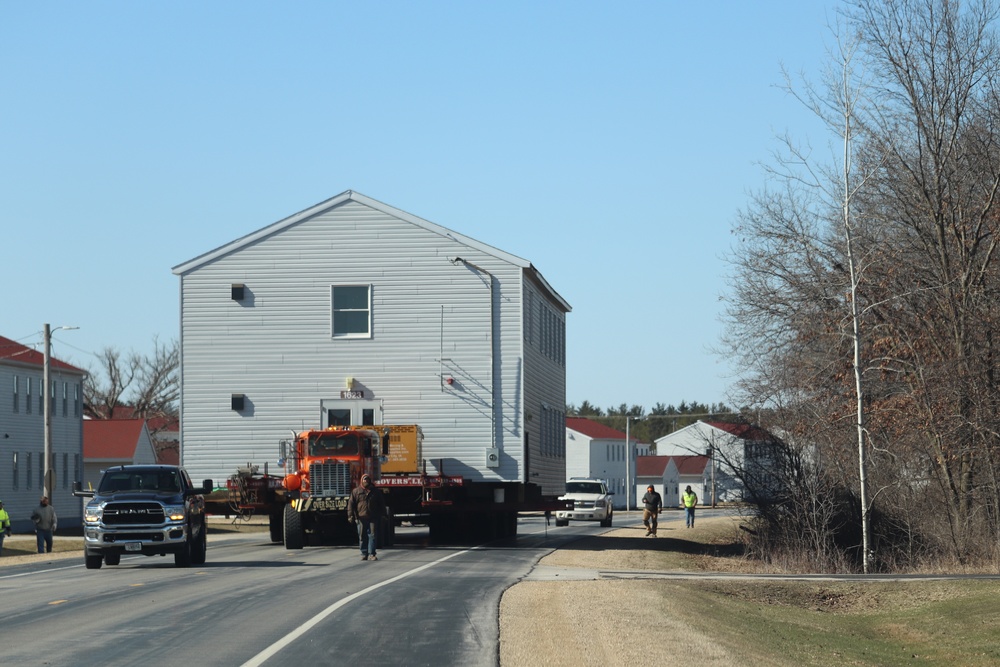 Contractors move fourth World War II-era barracks to new location in April 2023