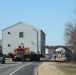 Contractors move fourth World War II-era barracks to new location in April 2023