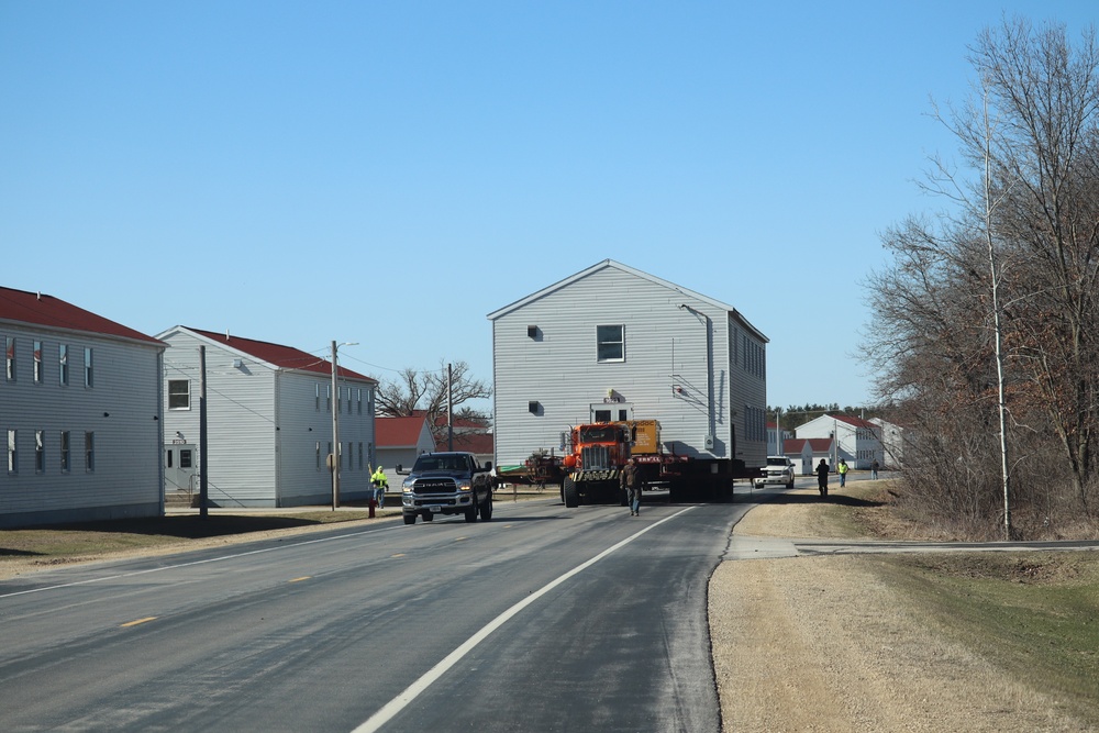 Contractors move fourth World War II-era barracks to new location in April 2023