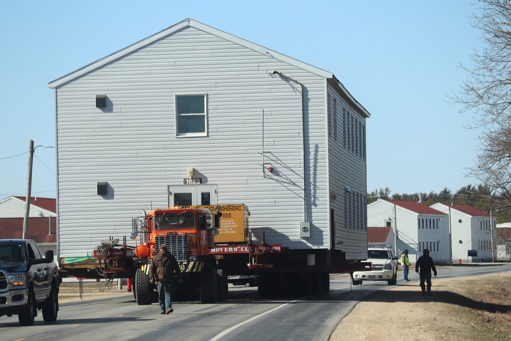 Contractors move fourth World War II-era barracks to new location in April 2023