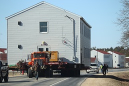 Contractors move fourth World War II-era barracks to new location in April 2023