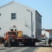 Contractors move fourth World War II-era barracks to new location in April 2023