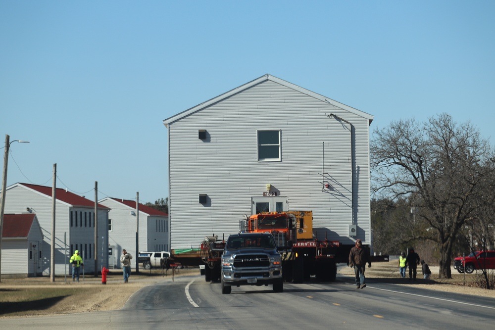 Contractors move fourth World War II-era barracks to new location in April 2023