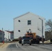 Contractors move fourth World War II-era barracks to new location in April 2023