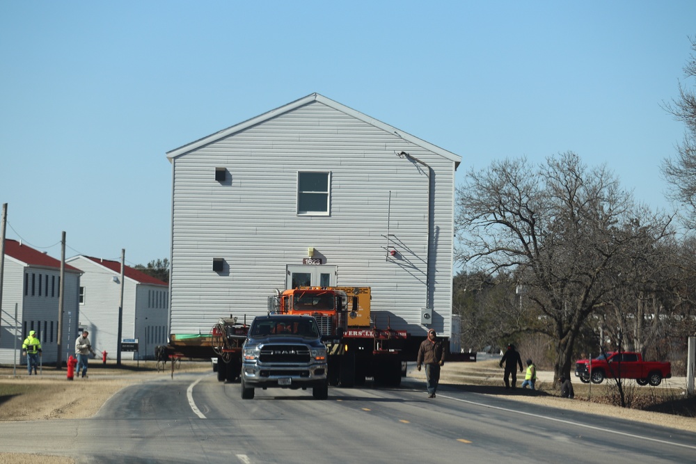 Contractors move fourth World War II-era barracks to new location in April 2023