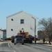 Contractors move fourth World War II-era barracks to new location in April 2023