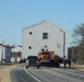 Contractors move fourth World War II-era barracks to new location in April 2023