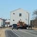 Contractors move fourth World War II-era barracks to new location in April 2023