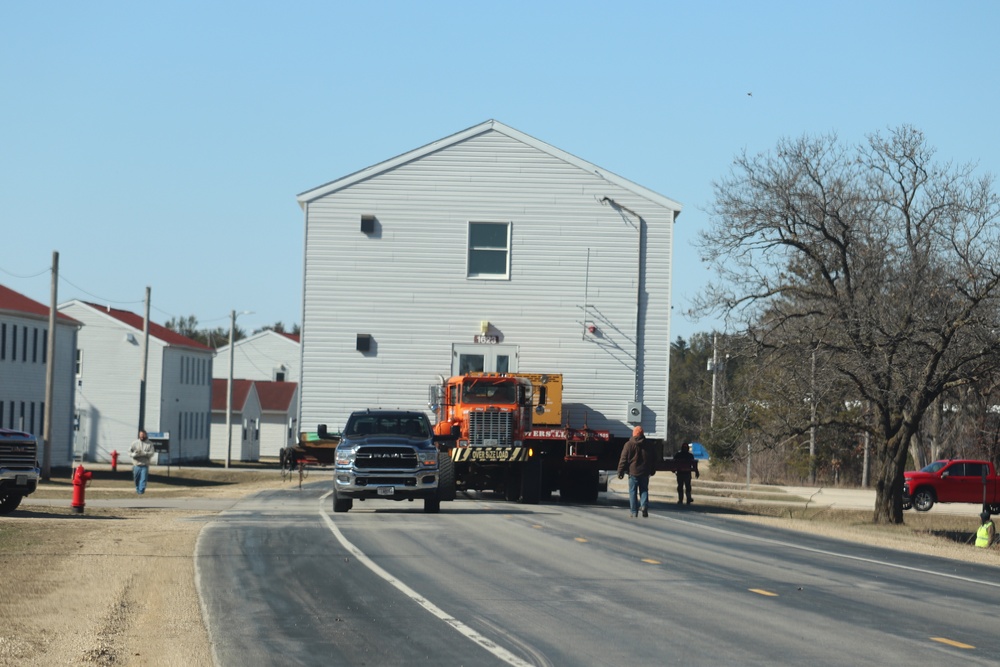 Contractors move fourth World War II-era barracks to new location in April 2023