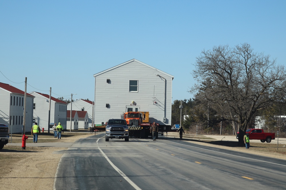 Contractors move fourth World War II-era barracks to new location in April 2023