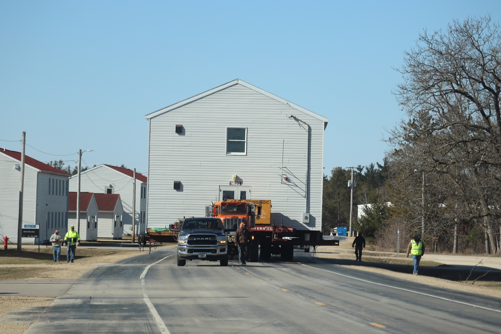 Contractors move fourth World War II-era barracks to new location in April 2023