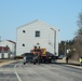 Contractors move fourth World War II-era barracks to new location in April 2023