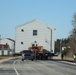 Contractors move fourth World War II-era barracks to new location in April 2023