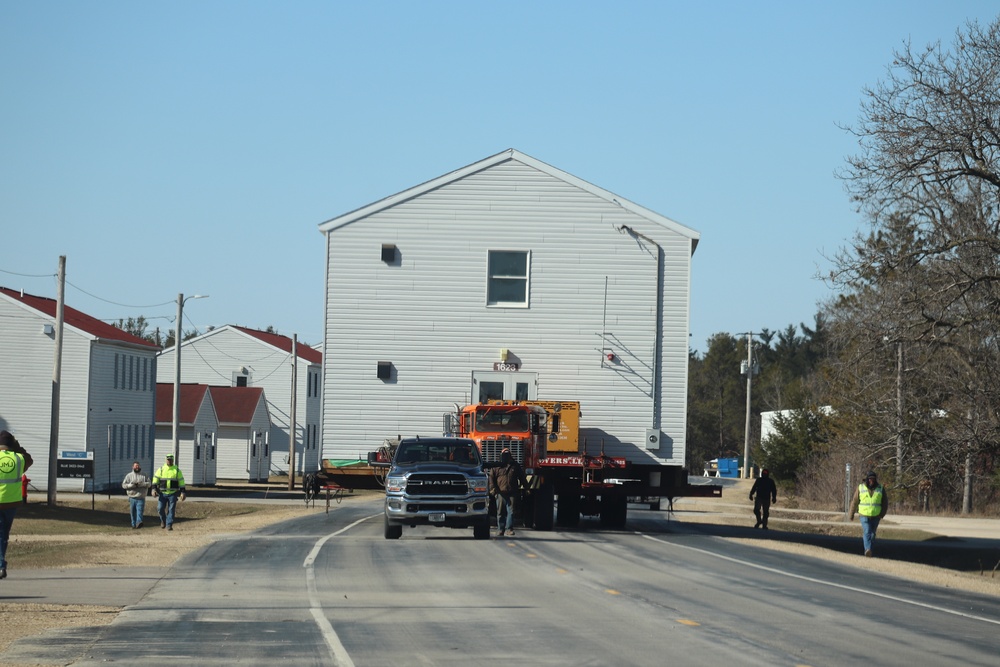 Contractors move fourth World War II-era barracks to new location in April 2023