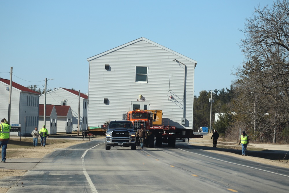 Contractors move fourth World War II-era barracks to new location in April 2023