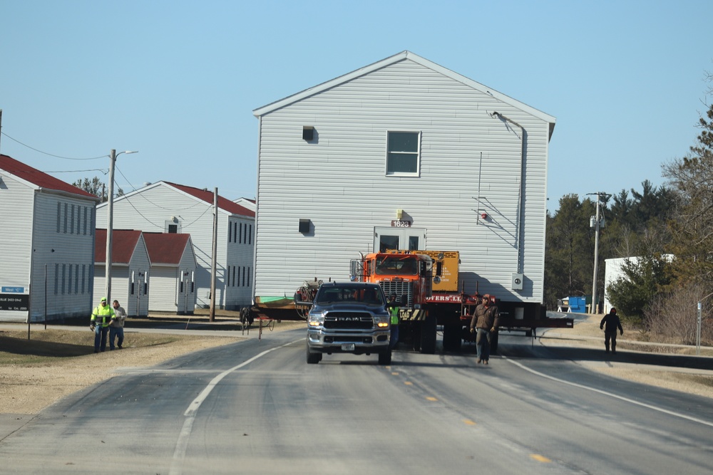 Contractors move fourth World War II-era barracks to new location in April 2023