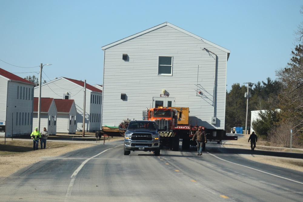 Contractors move fourth World War II-era barracks to new location in April 2023