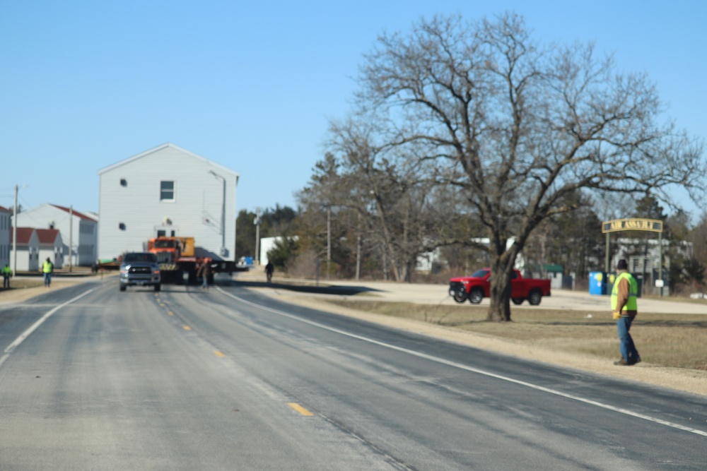 Contractors move fourth World War II-era barracks to new location in April 2023