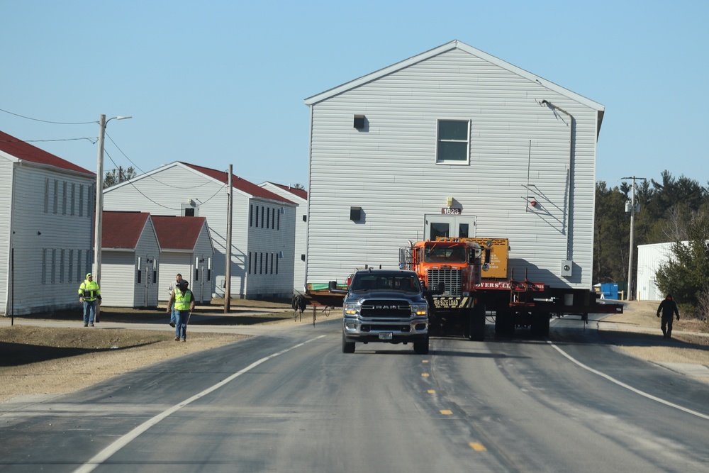 Contractors move fourth World War II-era barracks to new location in April 2023