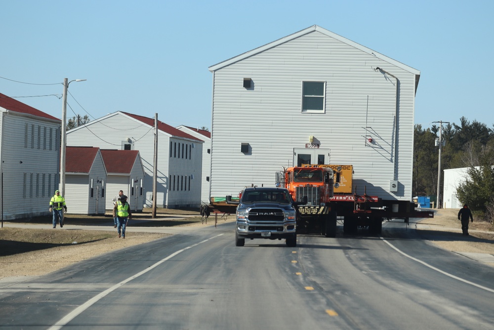 Contractors move fourth World War II-era barracks to new location in April 2023