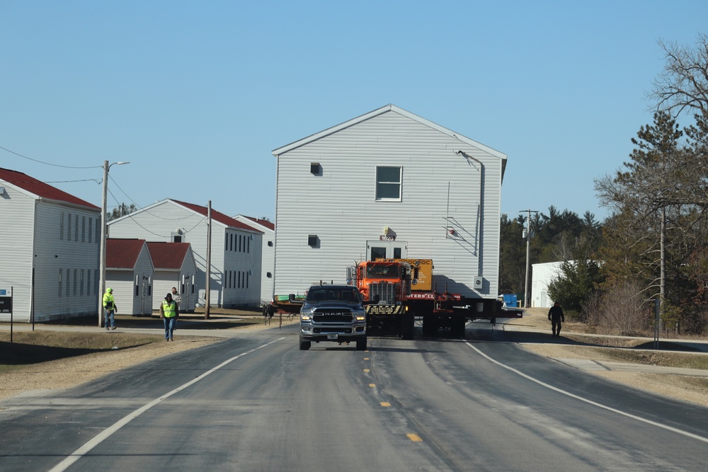 Contractors move fourth World War II-era barracks to new location in April 2023