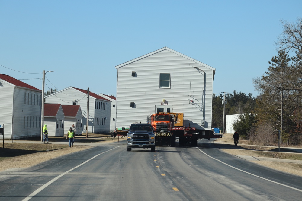 Contractors move fourth World War II-era barracks to new location in April 2023