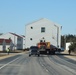 Contractors move fourth World War II-era barracks to new location in April 2023