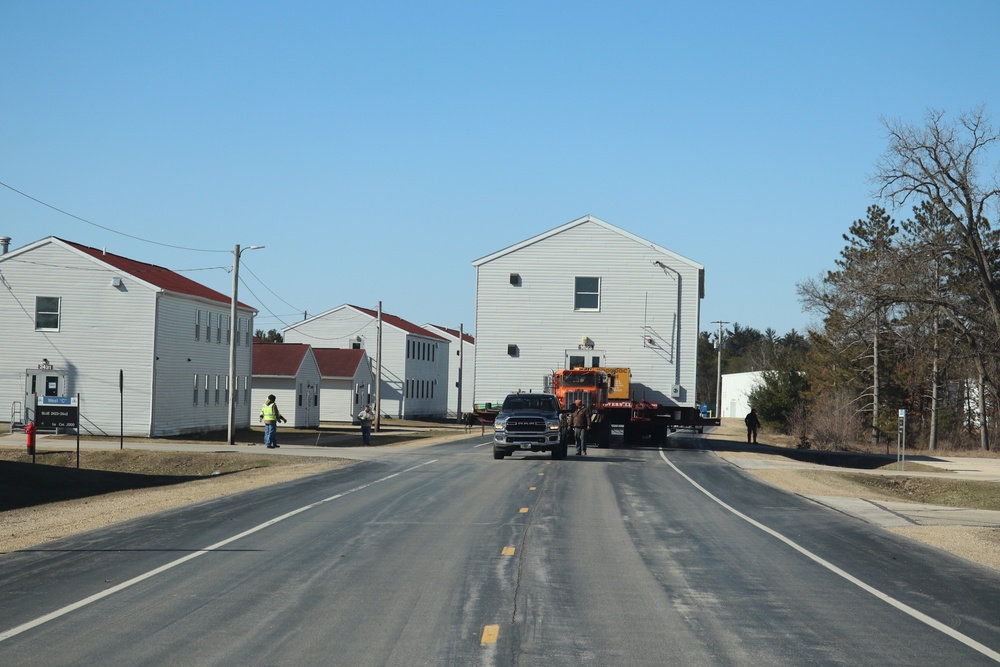 Contractors move fourth World War II-era barracks to new location in April 2023