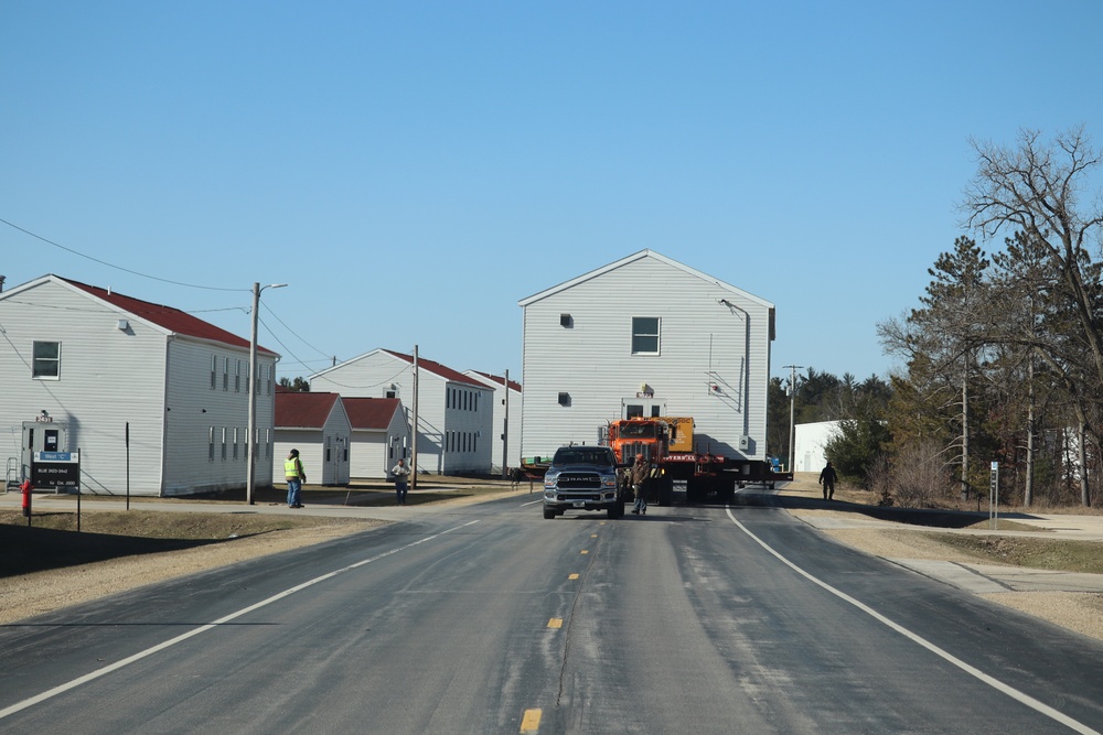 Contractors move fourth World War II-era barracks to new location in April 2023