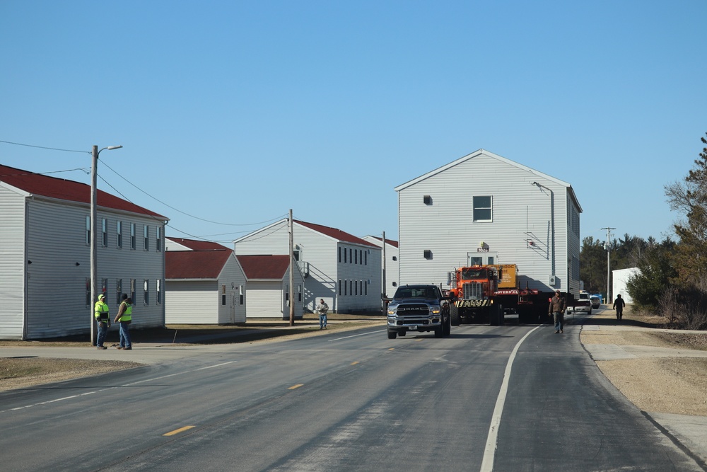 Contractors move fourth World War II-era barracks to new location in April 2023