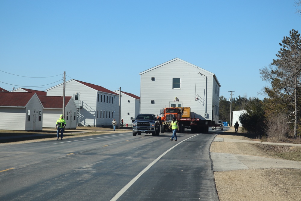 Contractors move fourth World War II-era barracks to new location in April 2023